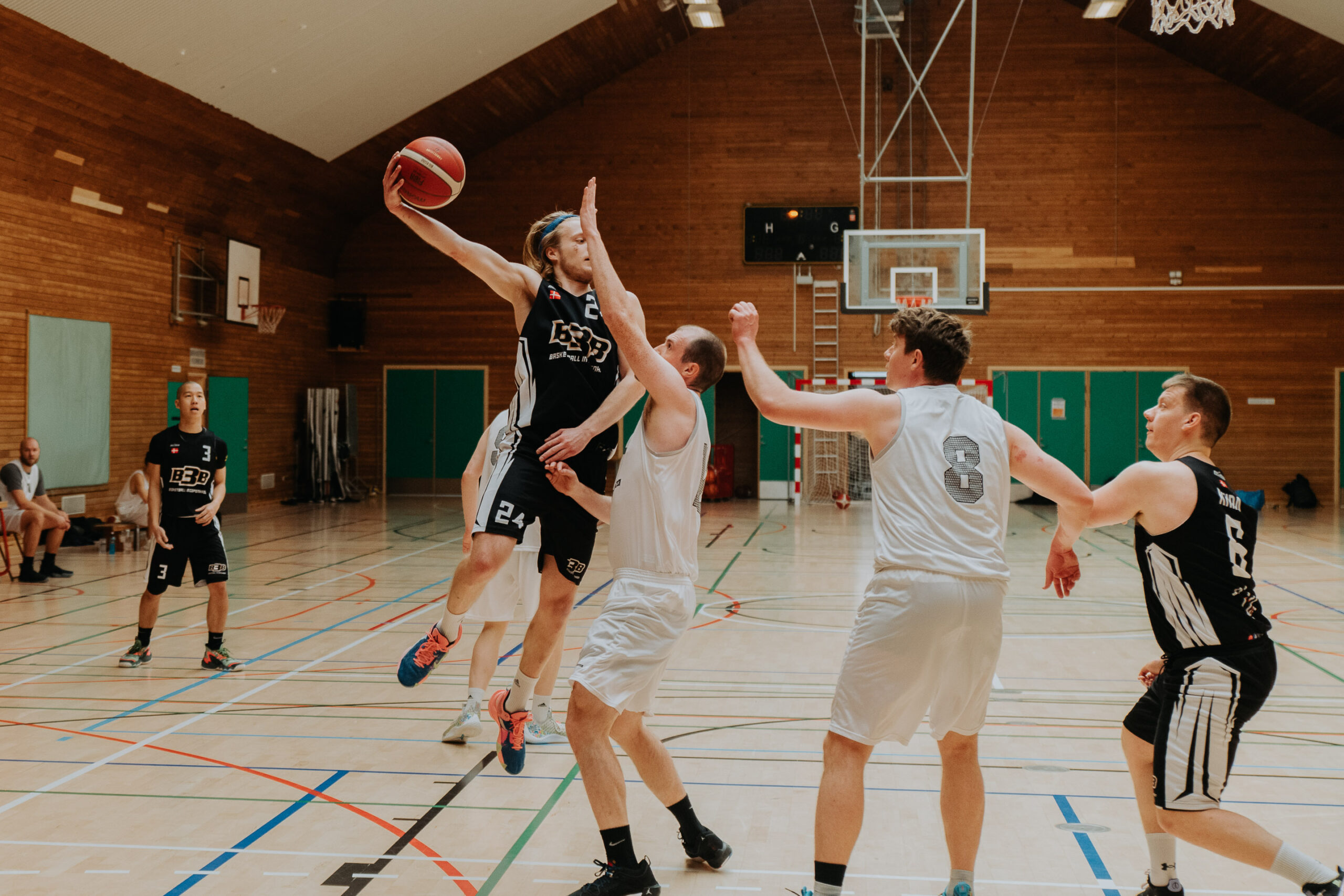 Men playing basketball